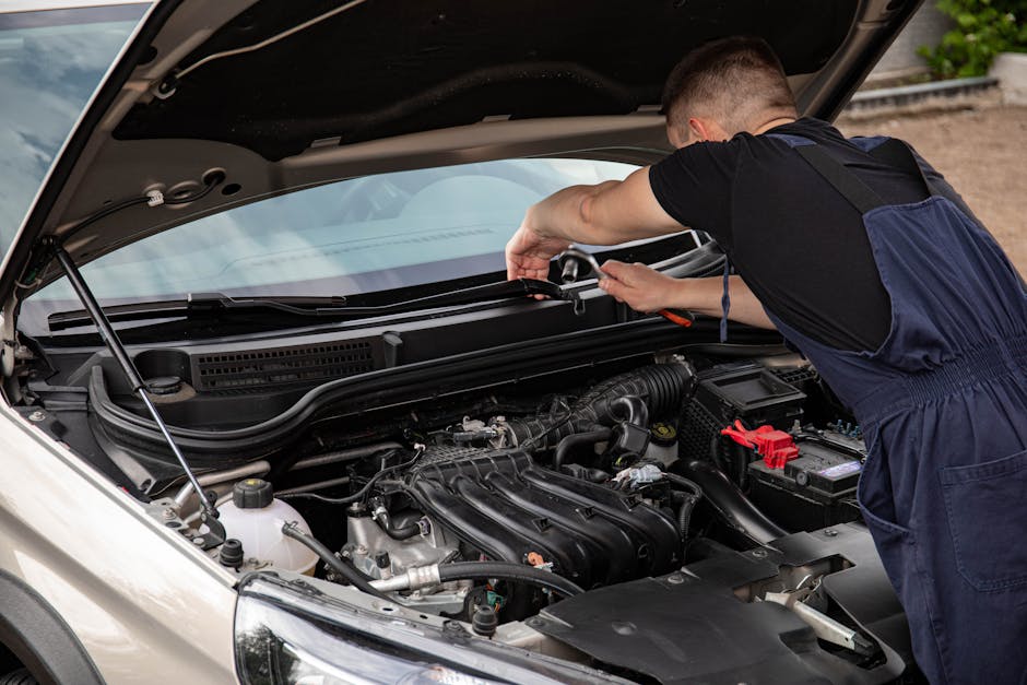 Mechanic using an impact wrench for tire installation